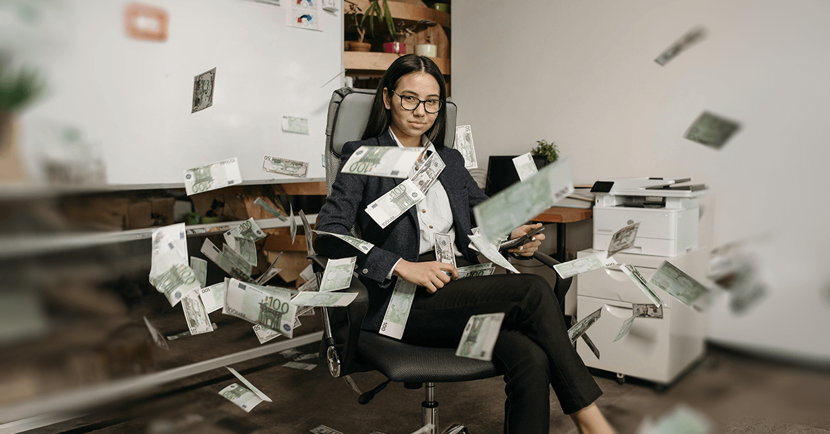 A professional businesswoman sits in an office chair as euro bills rain down around her, symbolizing high profitability and significant cash flow.